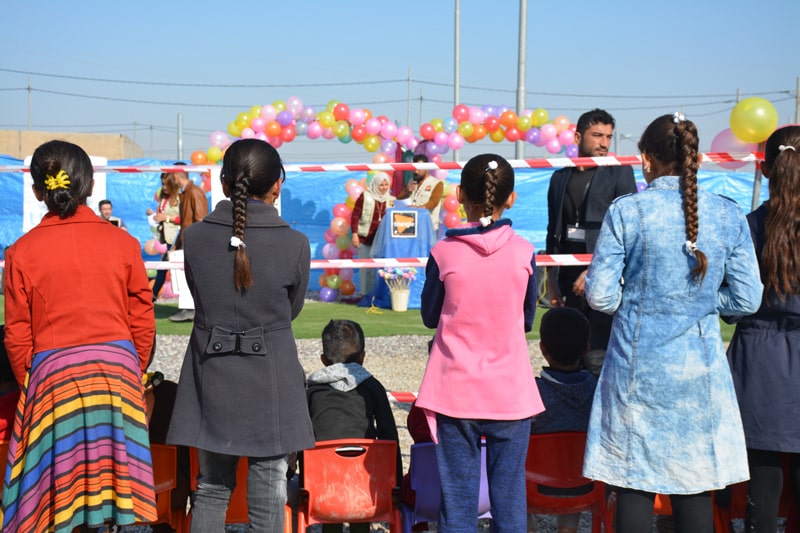 Young adolescent girls and children attending TGH event organized for Children's Day